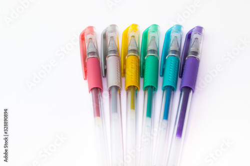 Set of color plastic gel pens with metallic colors, isolated on white background