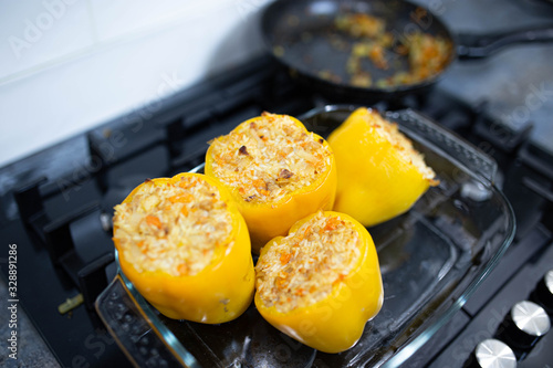 stuffed yellow peppers with rice in the oven.