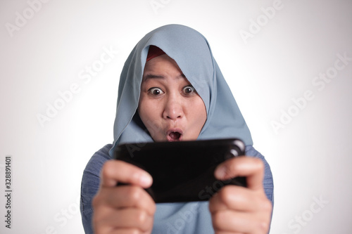 Muslim Woman Excited to Play Games on Phone