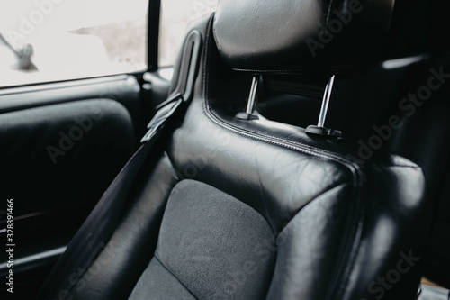 leather black interior of a luxury car. handmade leather upholstery