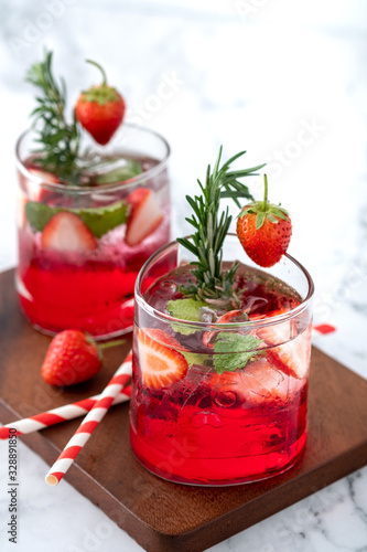 Summer strawberry drink on marble white background.