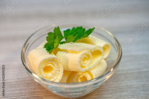 Butter parsley with butter on a wooden table in a bowl