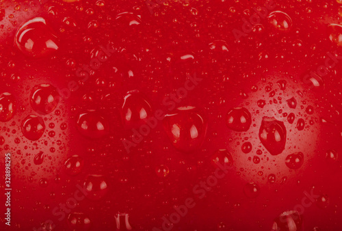 red tomato with water drops background