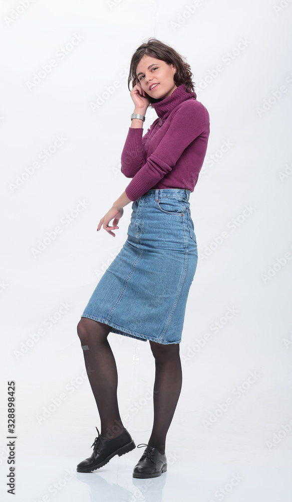 fashionable young woman in denim skirt. isolated on white fashionable young woman in denim skirt. isolated on white