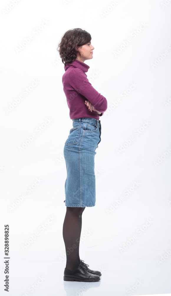 side view. fashionable young woman in denim skirt. side view. fashionable young woman in denim skirt.