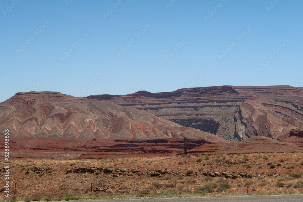 Landscape of barren colorfully striped hills in Southern Utah Landscape of barren colorfully striped hills in Southern Utah