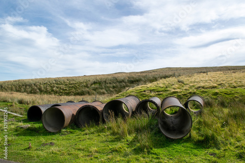 A stack of large pipes lying on the ground