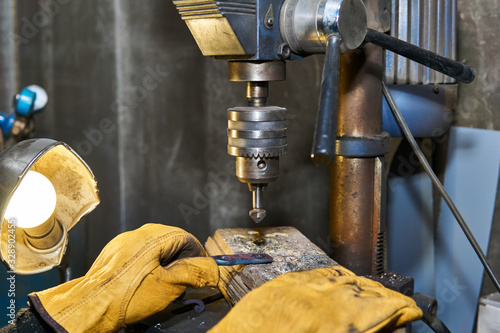 work on a drilling machine with a countersink close-up