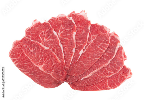 Many raw beef meat slices isolated on white