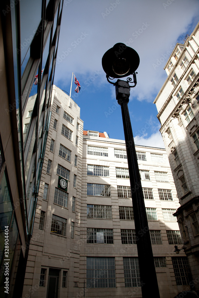 an art decor era building in London , England with the Union flag flying from the top