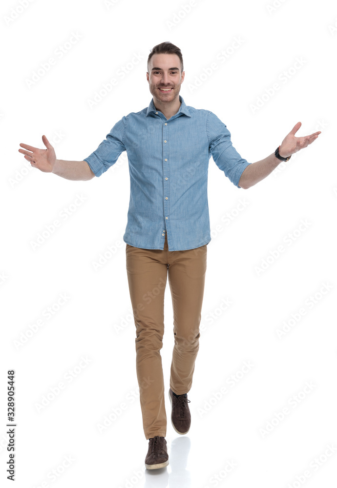 Cheerful casual man smiling and welcoming Cheerful casual man smiling and welcoming