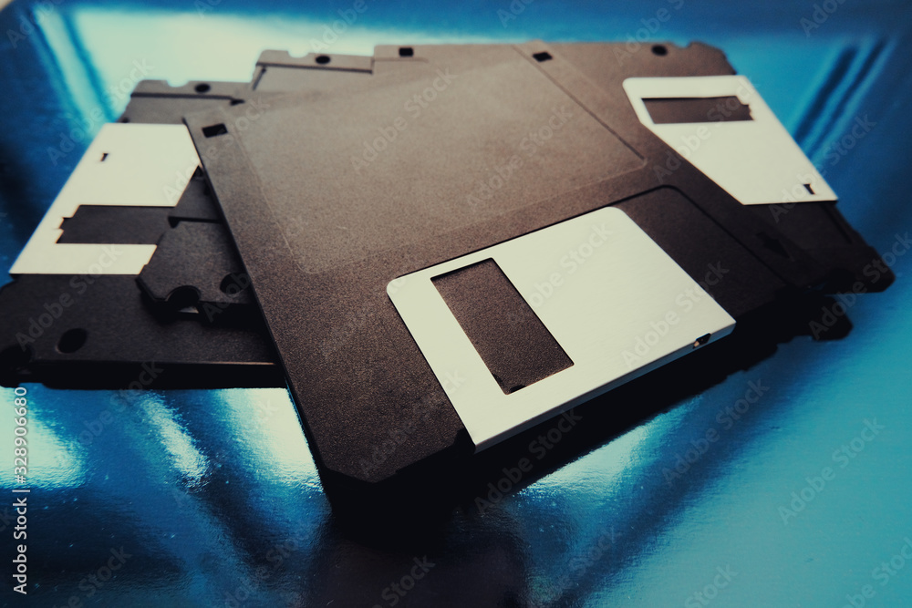 Fototapeta premium A computer floppy disk. An old magnetic media. Vintage computers.Old magnetic media.