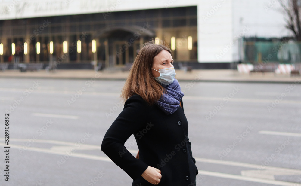 Fototapeta premium young european woman in protective disposable medical mask. concept protection of dangerous 2019-nCoV influenza coronavirus, mutated and spreading in China