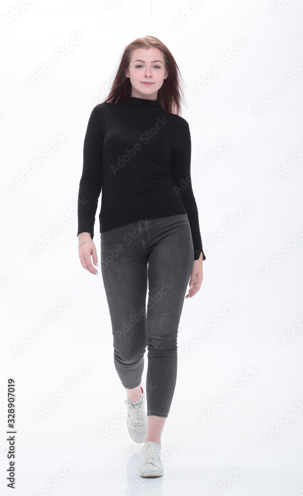 full length . modern young woman stepping forward full length . modern young woman stepping forward