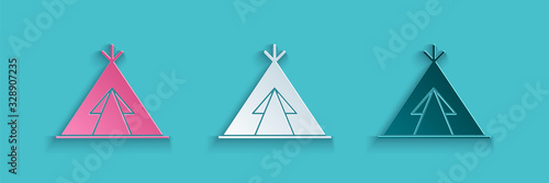 Paper cut Traditional indian teepee or wigwam icon isolated on blue background. Indian tent. Paper art style. Vector Illustration