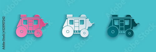 Paper cut Western stagecoach icon isolated on blue background. Paper art style. Vector Illustration