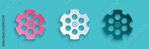 Paper cut Revolver cylinder icon isolated on blue background. Paper art style. Vector Illustration