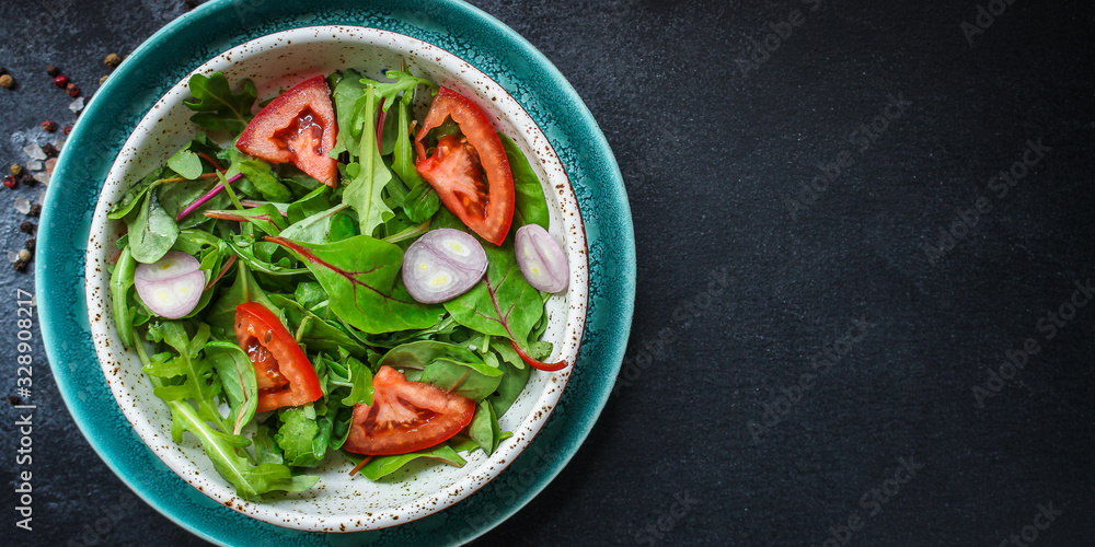 healthy salad tomato, mix leaves, onions and other ingredients, vegan, keto or paleo menu concept. top food background. copy space healthy salad tomato, mix leaves, onions and other ingredients, vegan, keto or paleo menu concept. top food background. copy space