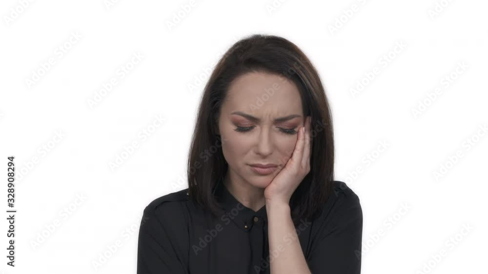 Portrait of young woman having toothache. Attractive girl with pain grimace at white studio background. Health care and dental issues concept Portrait of young woman having toothache. Attractive girl with pain grimace at white studio background. Health care and dental issues concept