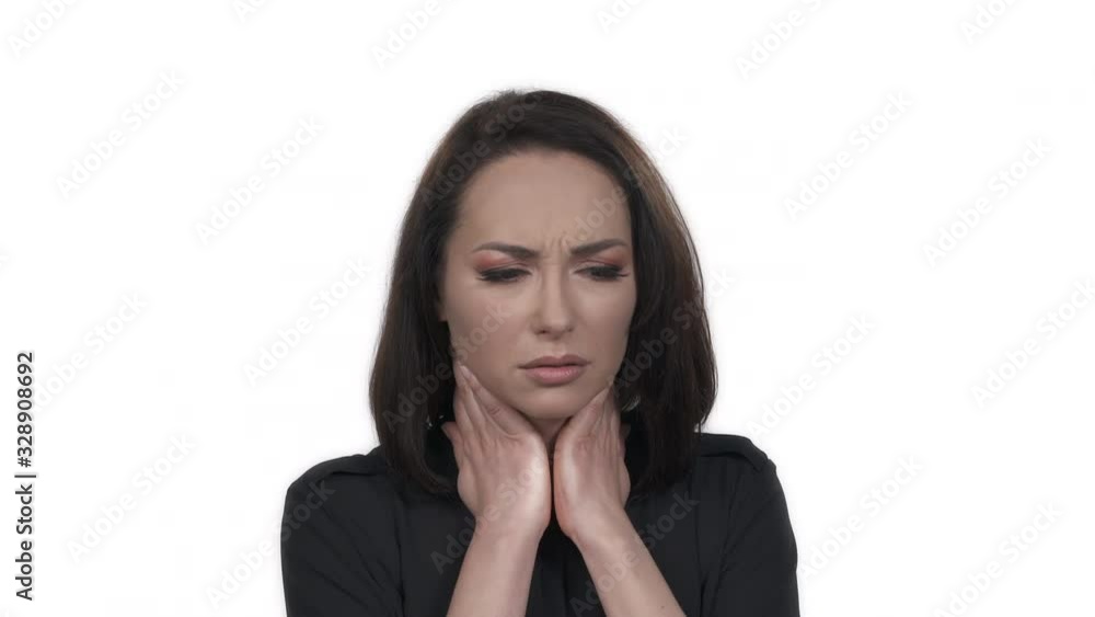Charming young woman with terrible throat pain. Sore throat, flue, viral infection. Isolated on white background Charming young woman with terrible throat pain. Sore throat, flue, viral infection. Isolated on white background
