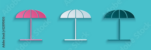 Paper cut Sun protective umbrella for beach icon isolated on blue background. Large parasol for outdoor space. Beach umbrella. Paper art style. Vector Illustration