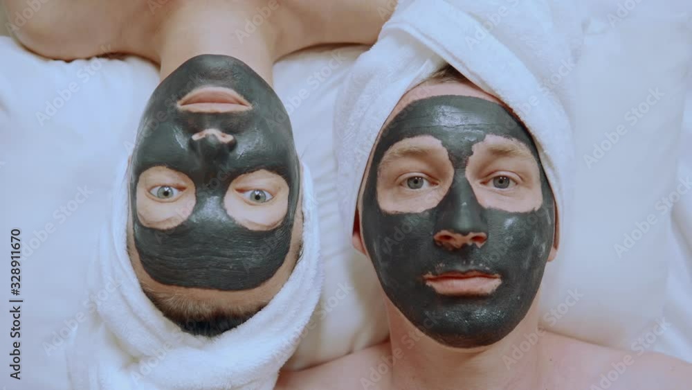 close up couple romantic spa woman and man with cosmetic mask on face beauty treatment for family close up couple romantic spa woman and man with cosmetic mask on face beauty treatment for family