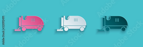 Paper cut Ice resurfacer icon isolated on blue background. Ice resurfacing machine on rink. Cleaner for ice rink and stadium. Paper art style. Vector Illustration