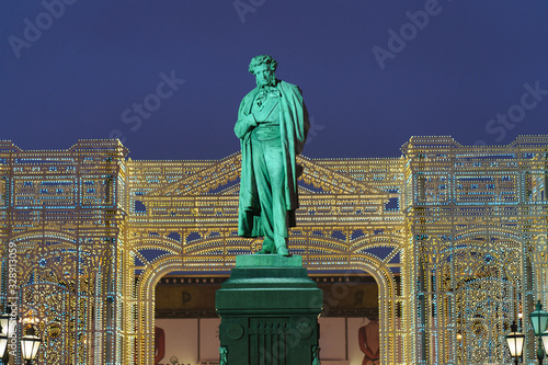 Photography of a bronze statue of russian poet Alexander Sergeyevich Pushkin in Moscow Pushkinskaya square. Literary heritage theme. photo