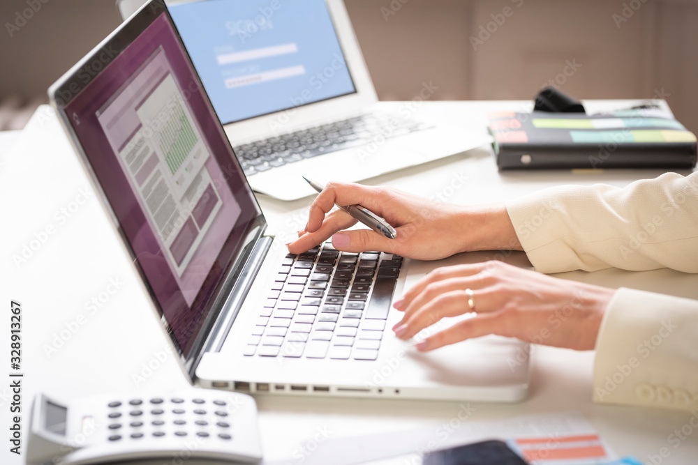 Fototapeta premium Businesswoman's hand typing on the keyboard