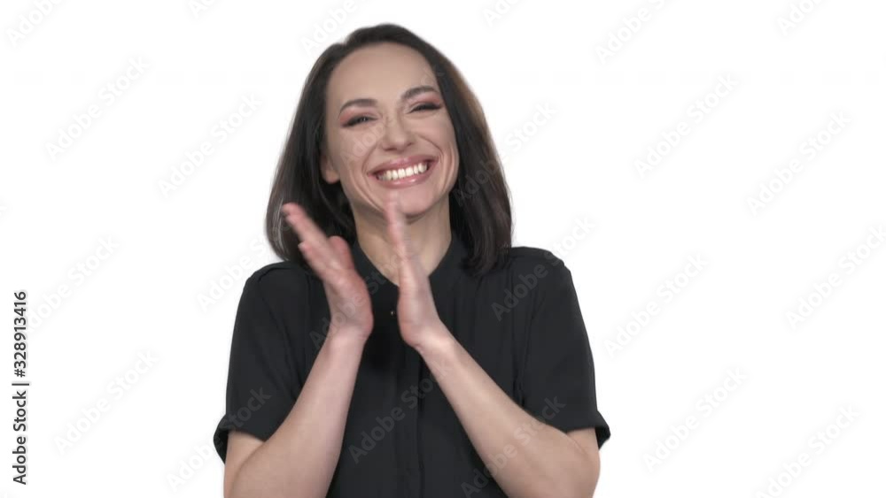Close-up portrait of a young sincere woman applauding, laughing, demonstrating great happiness, isolated on white background Close-up portrait of a young sincere woman applauding, laughing, demonstrating great happiness, isolated on white background