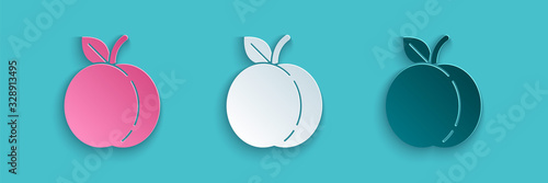 Paper cut Peach fruit or nectarine with leaf icon isolated on blue background. Paper art style. Vector Illustration