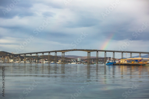 Wallpaper Mural View of Tromso, with cathedral, Tromso Bridge, Tromsoya island, embankment and scenery beyond the city, Troms og Finnmark county, Norway, summer day Torontodigital.ca