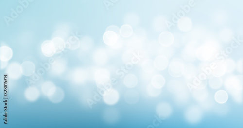 Bokeh light on blue background, sky with circle glitter light blur. Abstract soft glowing snow with vivid bright light and bokeh blur effect © Ron Dale