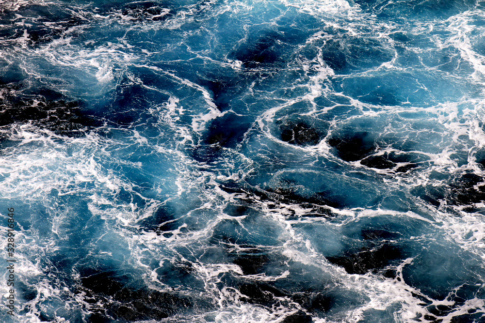 Ocean waves wallpaper, Dark blue water and sea foam from aerial view, Natural abstract pattern background with copy space for web banner and design template.