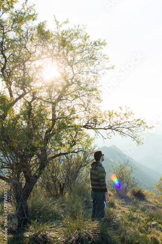 Man standing near tree in nature
