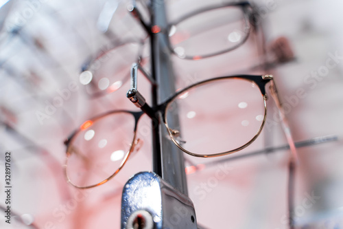 Various spectacles on display in optical store. Close-up