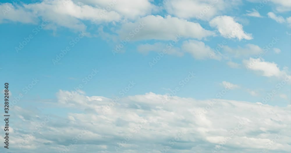 Beautiful blue sky with clouds background timelapse. White rolling, fast motion time lapse clouds in horizon. 4K Cloudscape time lapse Beautiful blue sky with clouds background timelapse. White rolling, fast motion time lapse clouds in horizon. 4K Cloudscape time lapse