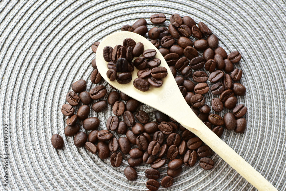Colombian coffee beans, displayed in containers and spoons Colombian coffee beans, displayed in containers and spoons