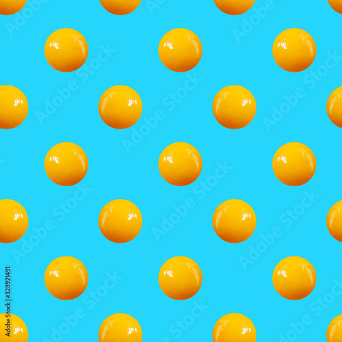Seamless pattern of egg yolks on a blue background. Isometric concept