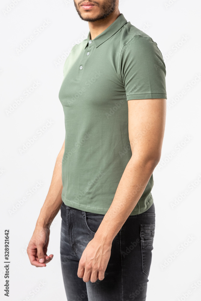 Obraz premium a man in a khaki Polo shirt on a white background, shirt with space for lettering, copying space