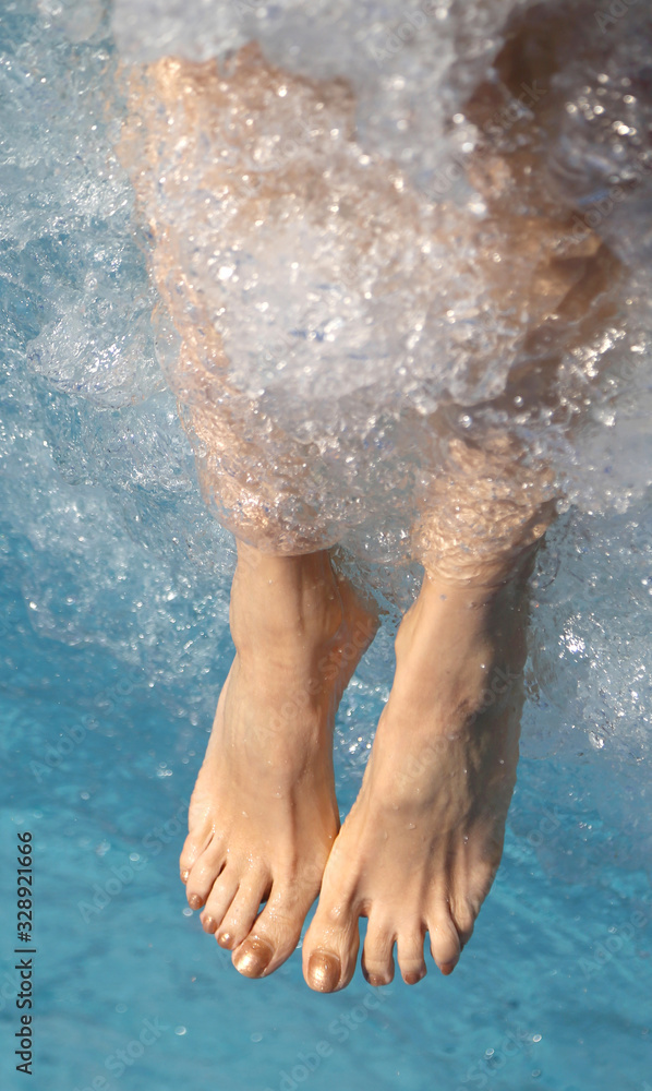 feet of a young woman during the hydromassage session