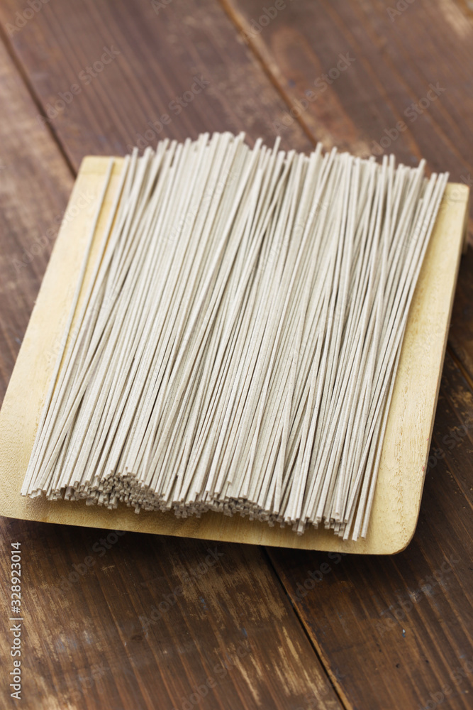 Fototapeta premium dried Soba ( Japanese buckwheat noodles) isolated on wooden background