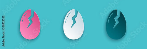 Paper cut Broken egg icon isolated on blue background. Happy Easter. Paper art style. Vector Illustration