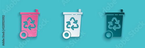 Paper cut Recycle bin with recycle symbol icon isolated on blue background. Trash can icon. Garbage bin sign. Recycle basket sign. Paper art style. Vector Illustration