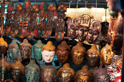 A buddhist masks store placed in a local street market in Chiang Mai. Handmade masks and buddha faces.