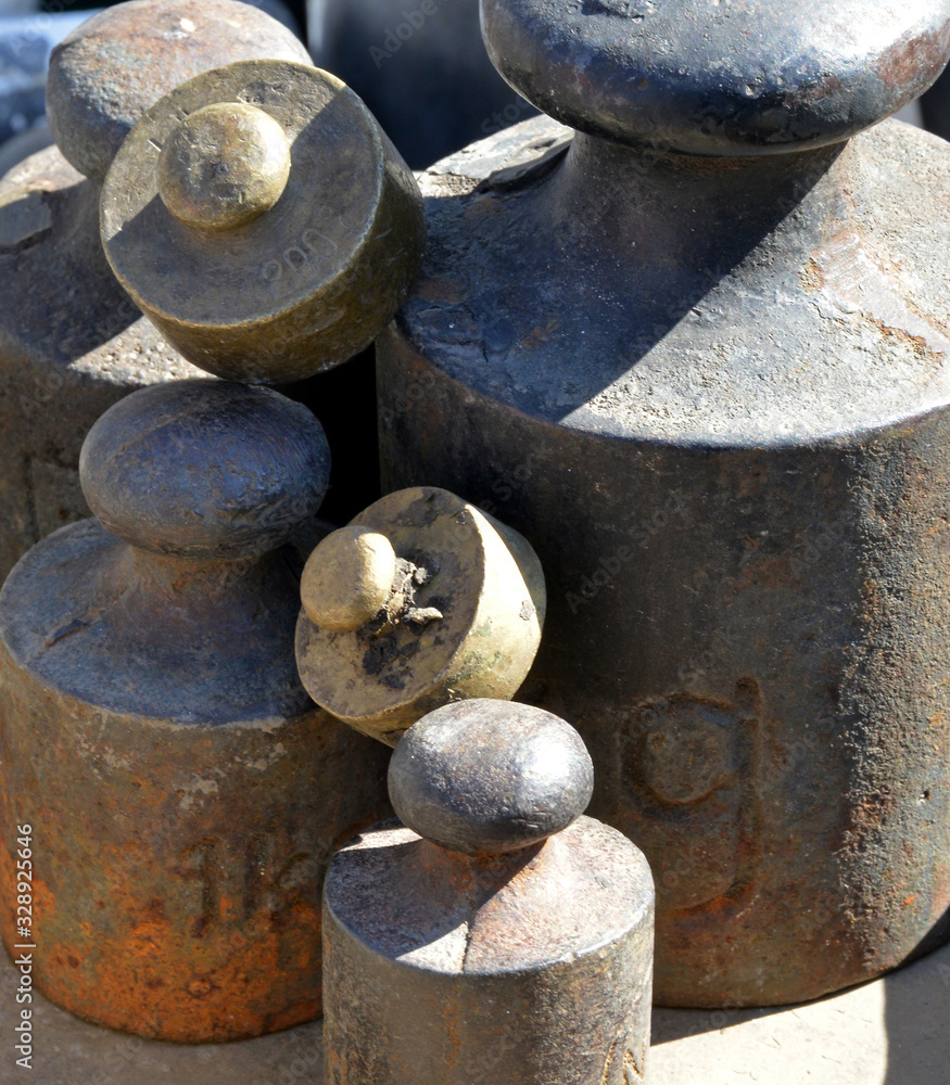 old weights and scales on a background