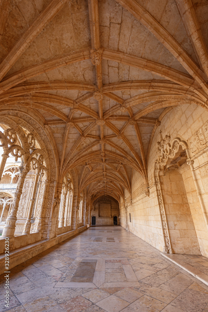 Ornamental and empty cloister at the historic Manueline style Mosteiro dos Jeronimos (Jeronimos Monastery) in Belem, Lisbon, Portugal.