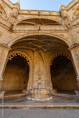 Cloister's ornate facade at the historic Manueline style Mosteiro dos Jeronimos (Jeronimos Monastery) in Belem, Lisbon, Portugal.