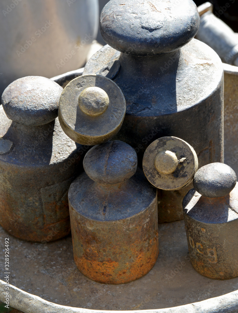 old weights and scales on a background old weights and scales on a background