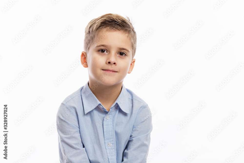 Laughing school boy in a blue shirt. Isolated over white background. Laughing school boy in a blue shirt. Isolated over white background.